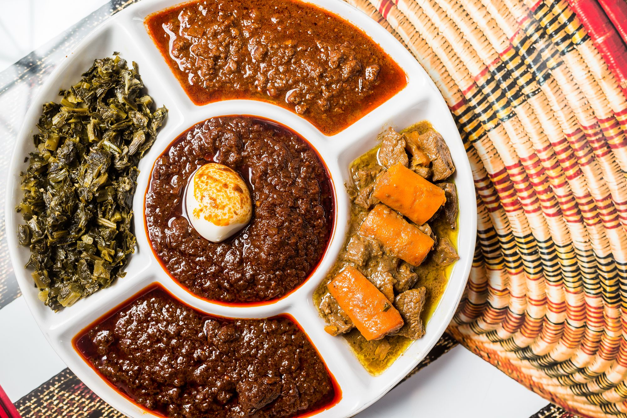 Ethiopian mesob with injera and communal dishes