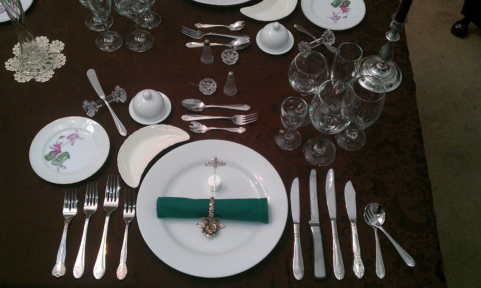 Formal Western table setting with fork, knife, and spoon